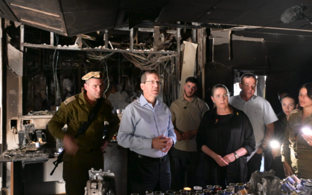 President Isaac Herzog and his wife Michal visit the Nahal Oz base on October 8, 2024 (Amos Ben Gershom/GPO)