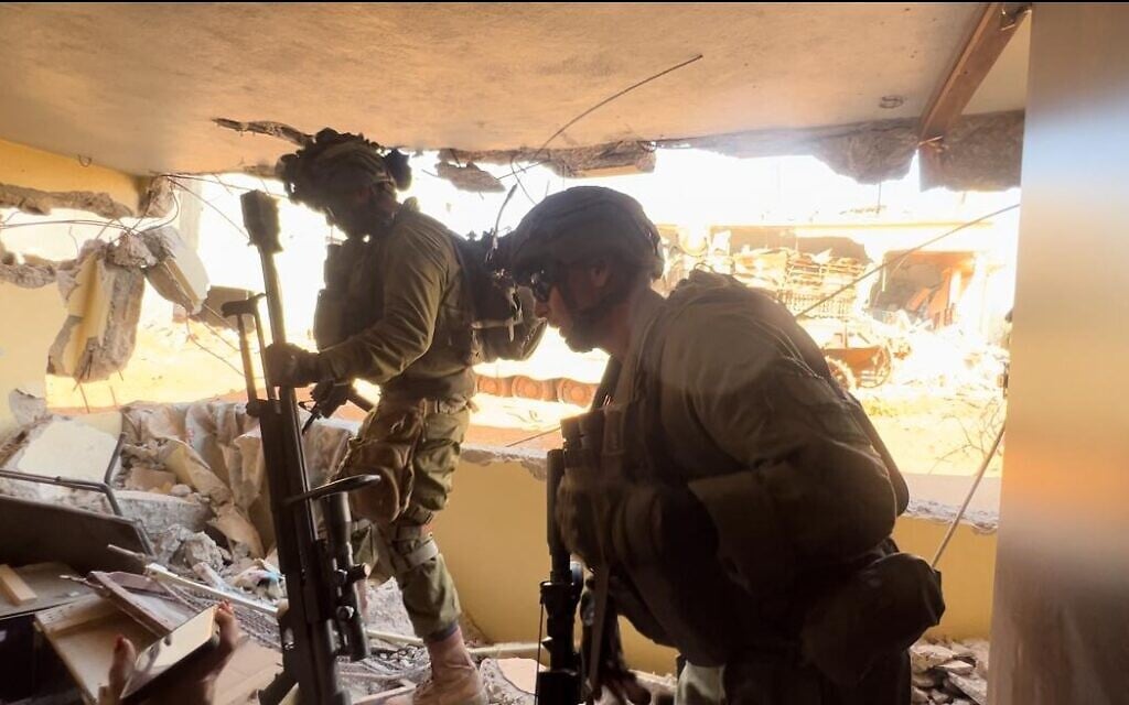 91st Division commander Brig. Gen. Shai Klepper (R) in southern Lebanon in a Hezbollah weapons cache his troops uncovered, October 10, 2024. (Lazar Berman/Times of Israel)