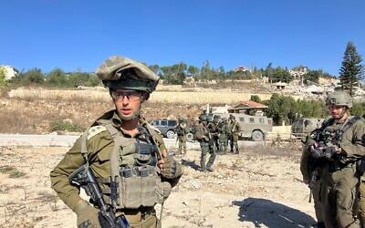Col. Avi Marciano, the commander of the 769th 'Hiram' Regional Brigade, leads a group of journalists into Lebanon on October 28, 2024. (Diana Bletter/Times of Israel)