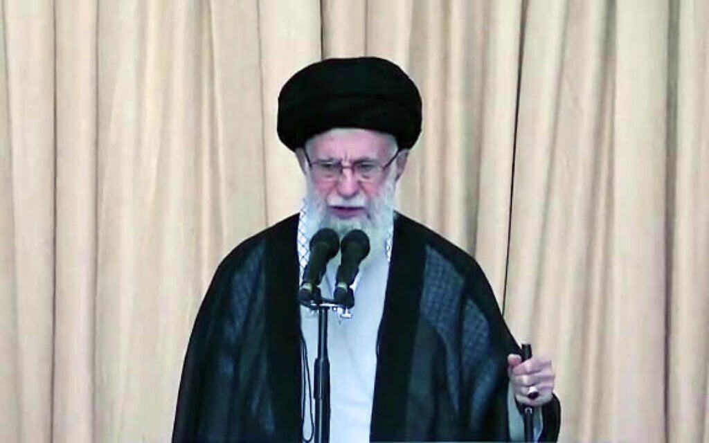 Iran's Supreme leader Ali Khamenei holds a rifle as he delivers a sermon denouncing Israel and justifying Hamas's October 7 slaughter in Israel, in Tehran on October 4, 2024. (X screenshot used in accordance with clause 27a of the copyright law)