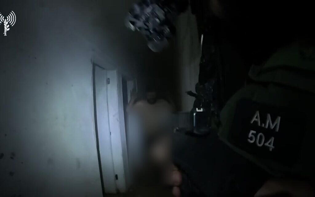 A Hezbollah operative is seen being detained by troops in southern Lebanon's Ayta ash-Shab, in October 2024, in a video released by the IDF on October 29, 2024. (Israel Defense Forces)