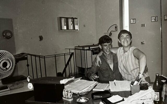 A photograph by Kibbutz Nir Oz resident photographer Yocheved Lifshitz of Pesia and Amikam in Nir Oz in the 1970s, from the 'Surviving Moments' exhibit at Musa Eretz Israel Museum, through December 14, 2024 (Courtesy Yocheved Lifshitz)