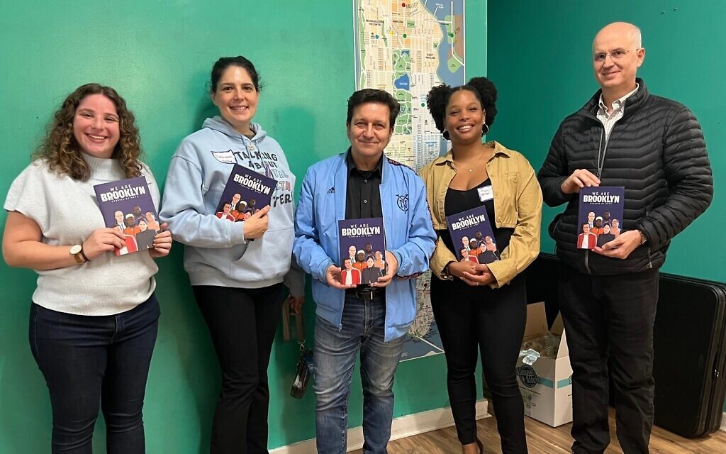 Left to right: Dani Kogan, Deborah Greenblatt, Julian Voloj, Francil Tejada and Bradley T. Borden hold copies of 'We Are Brooklyn: Stories of Hope,' a comic book celebrating the diversity of the borough and of participants in the We Are All Brooklyn Fellowship Against Hate, November 18, 2024. (Jackie Hajdenberg/JTA) Left to right: Dani Kogan, Deborah Greenblatt, Julian Voloj, Francil Tejada and Bradley T. Borden hold copies of 'We Are Brooklyn: Stories of Hope,' a comic book celebrating the diversity of the borough and of participants in the We Are All Brooklyn Fellowship Against Hate, November 18, 2024. (Jackie Hajdenberg/JTA)
