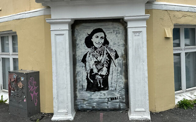 A mural of Anne Frank wearing a keffiyeh in Bergen, Norway, painted by the anonymous artist Töddel, July 2024. (Courtesy of Töddel via JTA)