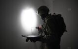 IDF troops measure the home of Abdelqader Qawasmeh, a Hamas terrorist who carried out a deadly shooting attack, ahead of its planned demolition, early November 15, 2024. (Israel Defense Forces)