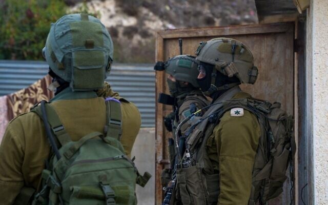 Israeli security forces operate at the home of Samir Muhammad Ahmad Hussein, a Hamas terrorist who carried out a shooting attack, in the West Bank village of Einabus, November 29, 2024. (Israel Defense Forces) Israeli security forces operate at the home of Samir Muhammad Ahmad Hussein, a Hamas terrorist who carried out a shooting attack, in the West Bank village of Einabus, November 29, 2024. (Israel Defense Forces)