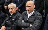 Prime Minister Benjamin Netanyahu (left) and former prime minister Naftali Bennett (right) attend the funeral of 
Rabbi Haim Drukman, at Merkaz Shapira, near Kiryat Malachi, on December 26, 2022. (Gil Cohen-Magen/ AFP)