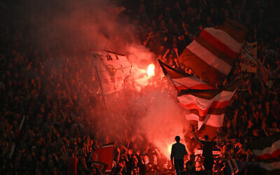 St Pauli supporters light flares during the German first division Bundesliga football match between BVB Borussia Dortmund and FC St Pauli in Dortmund, western Germany on October 18, 2024. (Ina Fassbender/AFP) St Pauli supporters light flares during the German first division Bundesliga football match between BVB Borussia Dortmund and FC St Pauli in Dortmund, western Germany on October 18, 2024. (Ina Fassbender/AFP)