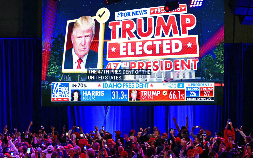 Supporters of former US president and Republican presidential candidate Donald Trump celebrate as Fox News declares him the next president of the United States during an election night event at the West Palm Beach Convention Center in West Palm Beach, Florida, early on November 6, 2024. (Jim Watson / AFP)
