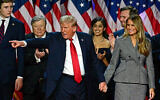 US President-elect and former president Donald Trump gestures at supporters after speaking as he holds hands with his wife, Melania Trump, during an election night event at the West Palm Beach Convention Center, Florida, on November 6, 2024. (Jim Watson / AFP)