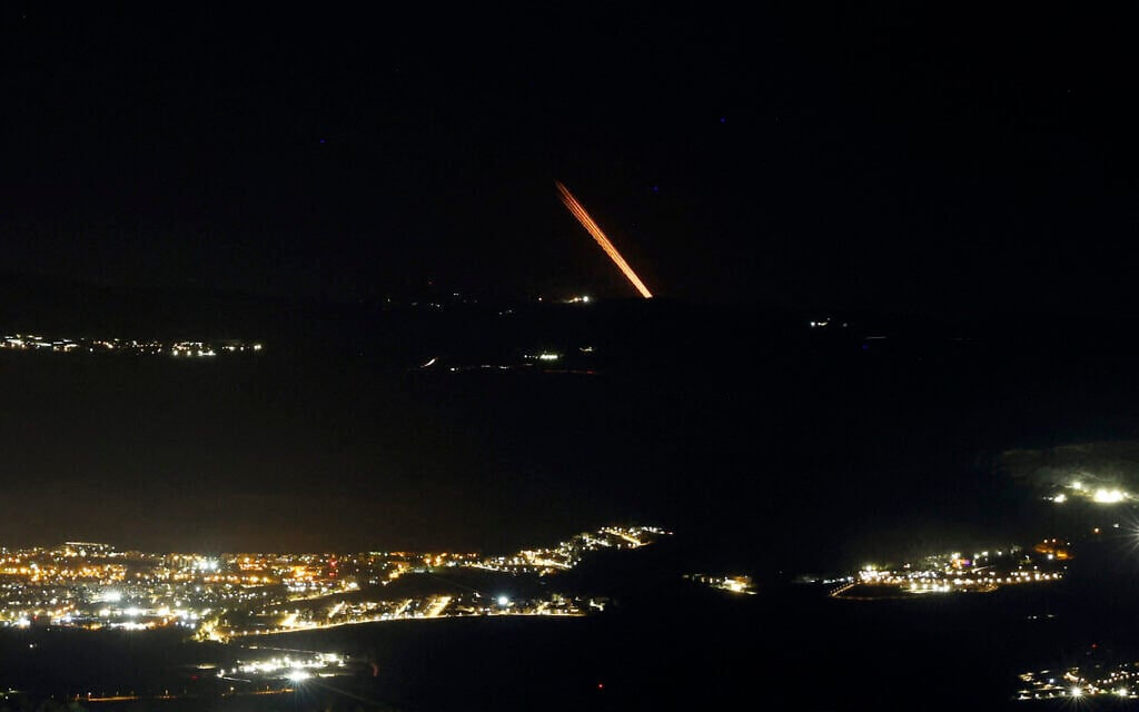 This picture taken in northern Israel along the border with Lebanon, shows a barrage of rockets fired from a position in south Lebanon toward Israel on November 6, 2024. (Jalaa Marey/AFP)