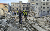 Rescuers and first responders gather at the site of overnight Israeli airstrikes in the southern Lebanese city of Tyre on November 9, 2024. (Kawnat Haju/AFP)