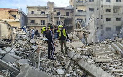Rescuers and first responders gather at the site of overnight Israeli airstrikes in the southern Lebanese city of Tyre on November 9, 2024. (Kawnat Haju/AFP)
