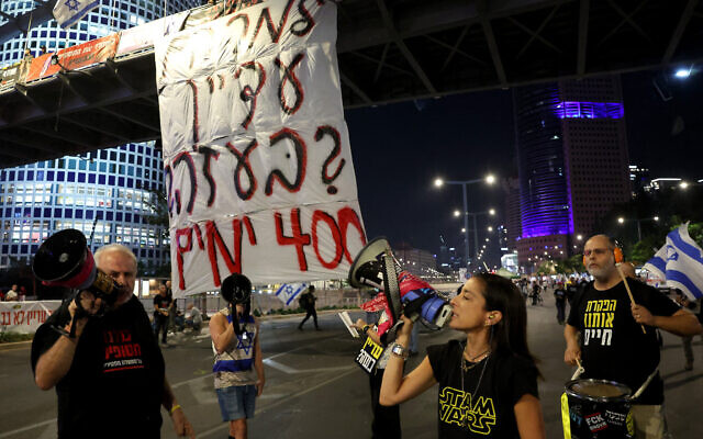 Israelis demanding the return of hostages held by Hamas demonstrate in front of a sign that reads "Why are the still in Gaza? 400 days," during a rally in Tel Aviv on November 9, 2024. (Jack Guez/AFP) Israelis demanding the return of hostages held by Hamas demonstrate in front of a sign that reads "Why are the still in Gaza? 400 days," during a rally in Tel Aviv on November 9, 2024. (Jack Guez/AFP)