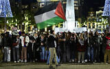 A protestor waves a Palestinian flag during an unauthorized pro-Palestinian, anti-Israel demonstration on Dam Square in Amsterdam on November 13, 2024. (Nick Gammon / AFP)