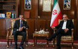 Iran's Foreign Minister Abbas Araghchi (R) and International Atomic Energy Agency (IAEA) Director General Rafael Mariano Grossi pose for a photo before their meeting in Tehran on November 14, 2024. (Atta Kenare/AFP)