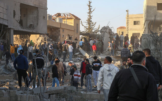 Rescuers gather at the site of an Israeli airstrike that targeted a house in the eastern Lebanese city of Baalbek on November 14, 2024. (Nidal Solh/AFP) Rescuers gather at the site of an Israeli airstrike that targeted a house in the eastern Lebanese city of Baalbek on November 14, 2024. (Nidal Solh/AFP)