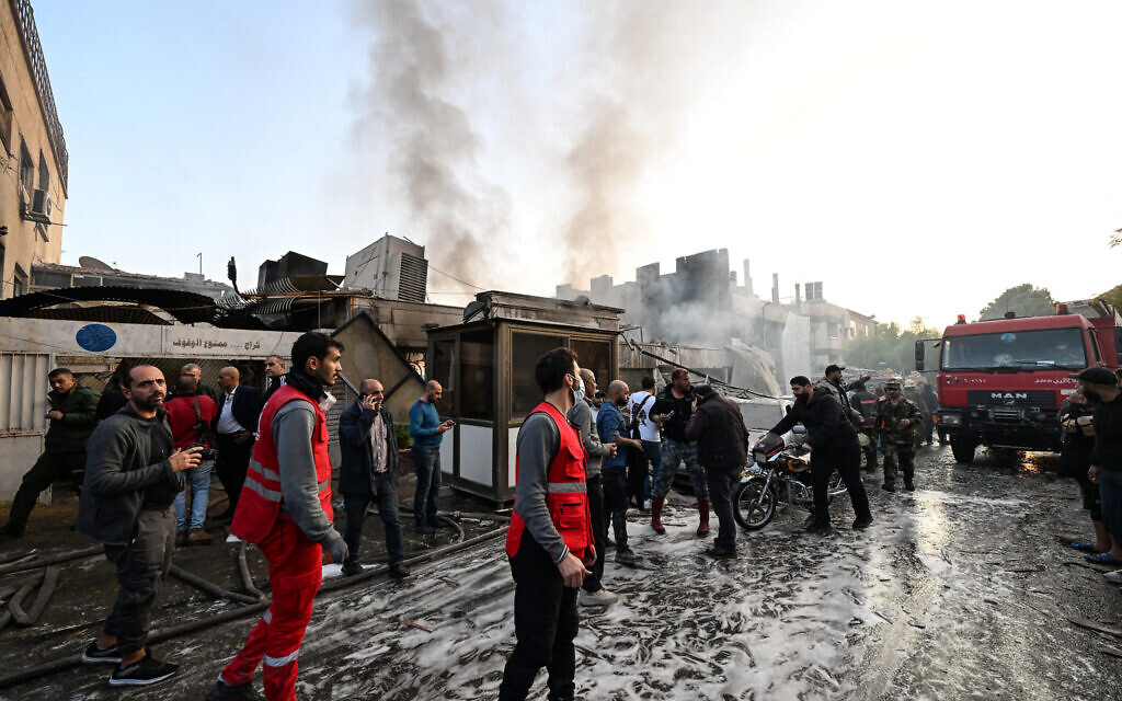 People check the damage following a reported Israeli strike in the Mazzeh district of Damascus on November 14, 2024. (LOUAI BESHARA / AFP)