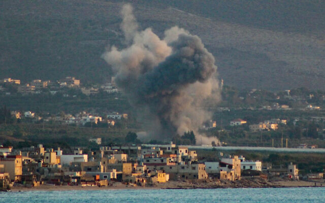 This picture taken from the southern Lebanese coastal city of Tyre shows smoke rising from the site of an Israeli airstrike that targeted the village of Qlayleh on November 16, 2024. (Kawnat Haju/AFP) This picture taken from the southern Lebanese coastal city of Tyre shows smoke rising from the site of an Israeli airstrike that targeted the village of Qlayleh on November 16, 2024. (Kawnat Haju/AFP)