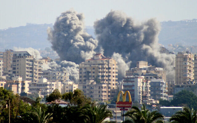 A photo taken from the southern Lebanese coastal city of Tyre shows smoke billowing following an Israeli airstrike on November 16, 2024. (Kawnat Haju/AFP) A photo taken from the southern Lebanese coastal city of Tyre shows smoke billowing following an Israeli airstrike on November 16, 2024. (Kawnat Haju/AFP)