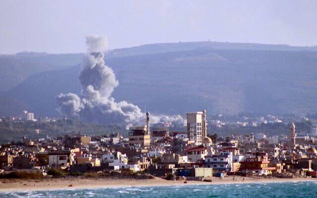 A photo taken from the southern Lebanese city of Tyre shows smoke rising from the site of an Israeli airstrike that targeted the village of Qlayleh on November 17, 2024. (Kawnat Haju / AFP) A photo taken from the southern Lebanese city of Tyre shows smoke rising from the site of an Israeli airstrike that targeted the village of Qlayleh on November 17, 2024. (Kawnat Haju / AFP)