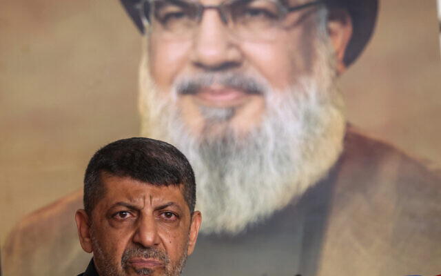 Spokesman for Lebanon's Hezbollah group Mohammad Afif addresses a press conference in Beirut, in front of a portrait of the group's slain chief Hassan Nasrallah, on November 11, 2024. (Anwar AMRO / AFP) Spokesman for Lebanon's Hezbollah group Mohammad Afif addresses a press conference in Beirut, in front of a portrait of the group's slain chief Hassan Nasrallah, on November 11, 2024. (Anwar AMRO / AFP)