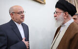 A handout picture provided by the Iranian Supreme Leader Ayatollah Ali Khamenei's office on November 17, 2024, shows him (R) talking to Iran's Ambassador to Lebanon Mojtaba Amani who was injured in Beirut in Israel's September pager attacks, in Tehran on November 17, 2024. (KHAMENEI.IR / AFP)