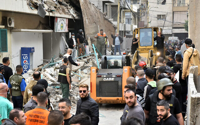 Residents, rescuers and journalists gather in front of a building targeted by an Israeli strike in Beirut's Ras al-Nabaa neighborhood on November 17, 2024 (Fadel ITANI / AFP) Residents, rescuers and journalists gather in front of a building targeted by an Israeli strike in Beirut's Ras al-Nabaa neighborhood on November 17, 2024 (Fadel ITANI / AFP)