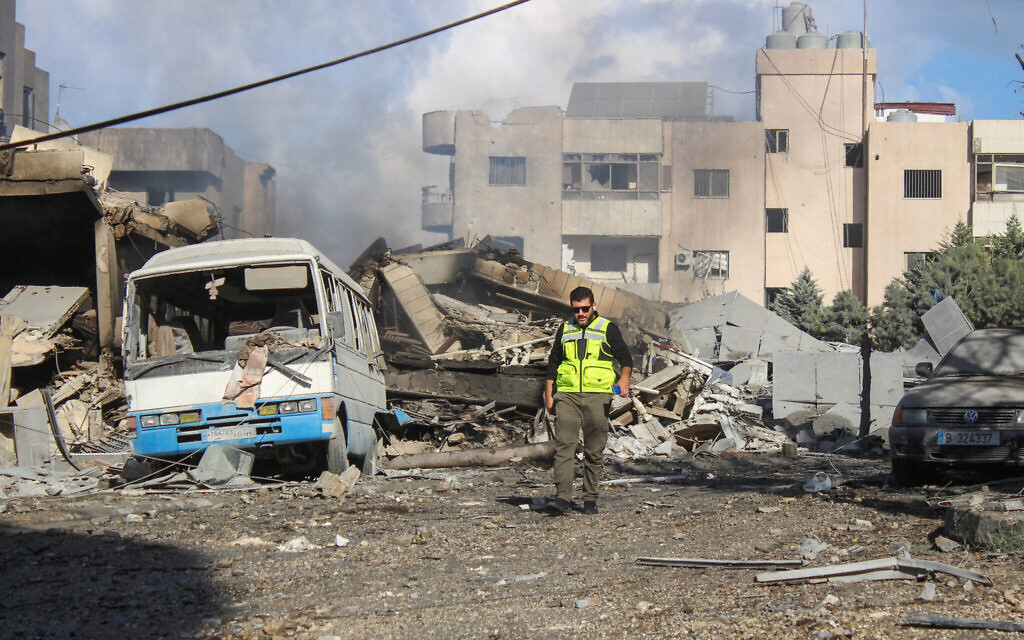 Workers remove the rubble from the site of Israeli airstrikes a day earlier that targeted the southern Lebanese town of al-Hawsh near the coastal city of Tyre on November 20, 2024. (KAWNAT HAJU / AFP)