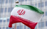 The Iranian flag outside the IAEA headquarters during the International Atomic Energy Agency's Board of Governors meeting at the agency's headquarters in Vienna, Austria, on November 20, 2024. (Joe Klamar/AFP)