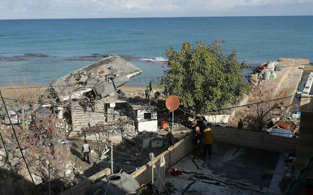 A Lebanese army inspection team check destruction at the site of an Israeli airstrike that hit a military position in the southern Lebanese coastal town of Sarafand on November 20, 2024. (MAHMOUD ZAYYAT / AFP)