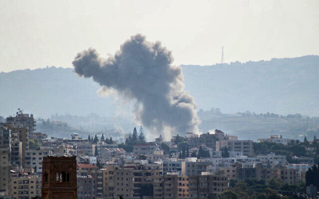 A photo taken from the southern Lebanese city of Tyre shows smoke billowing from an area targeted by an Israeli airstrike in al-Hawsh on the outskirts of the coastal city on November 21, 2024, as the war between Israel and Hezbollah continues. (Photo by KAWNAT HAJU / AFP) A photo taken from the southern Lebanese city of Tyre shows smoke billowing from an area targeted by an Israeli airstrike in al-Hawsh on the outskirts of the coastal city on November 21, 2024, as the war between Israel and Hezbollah continues. (Photo by KAWNAT HAJU / AFP)