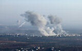 In this picture taken from the northern Syrian village of Ariha, smoke billows from the site of clashes and mutual shelling between Syrian opposition factions and regime forces on the front lines on the outskirts of the city of Saraqib in Syria's Aleppo province on November 28, 2024. (Photo by Omar HAJ KADOUR / AFP)