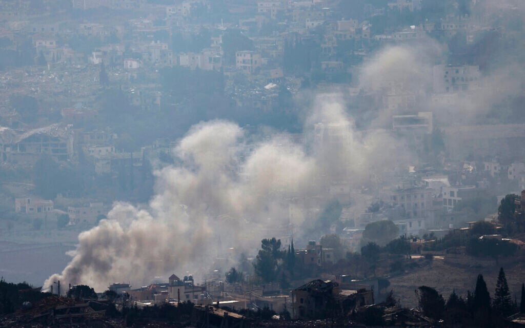 This picture taken from a position in northern Israel, on the border with Lebanon shows smoke billowing over the village of Meiss El-Jabal on November 28, 2024. - The IDF said it hit a Hezbollah facility where it detected a ceasefire violation. (Photo by Jalaa MAREY / AFP)