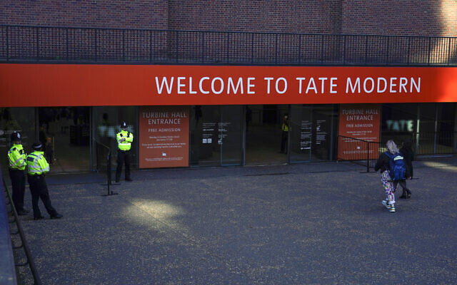 Police officers patrol the entrance of Tate Modern gallery, in London, Oct. 15, 2022. (AP Photo/Alberto Pezzali, File) Police officers patrol the entrance of Tate Modern gallery, in London, Oct. 15, 2022. (AP Photo/Alberto Pezzali, File)