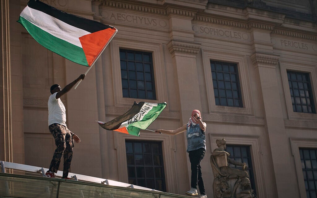 Pro-Palestinian, anti-Israel demonstrators wave flags over the Brooklyn Museum during a protest demanding a permanent ceasefire in Gaza, in the Brooklyn borough of New York, May 31, 2024. (AP Photo/Andres Kudacki)