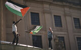 Pro-Palestinian, anti-Israel demonstrators wave flags over the Brooklyn Museum during a protest demanding a permanent ceasefire in Gaza, in the Brooklyn borough of New York, May 31, 2024. (AP Photo/Andres Kudacki)