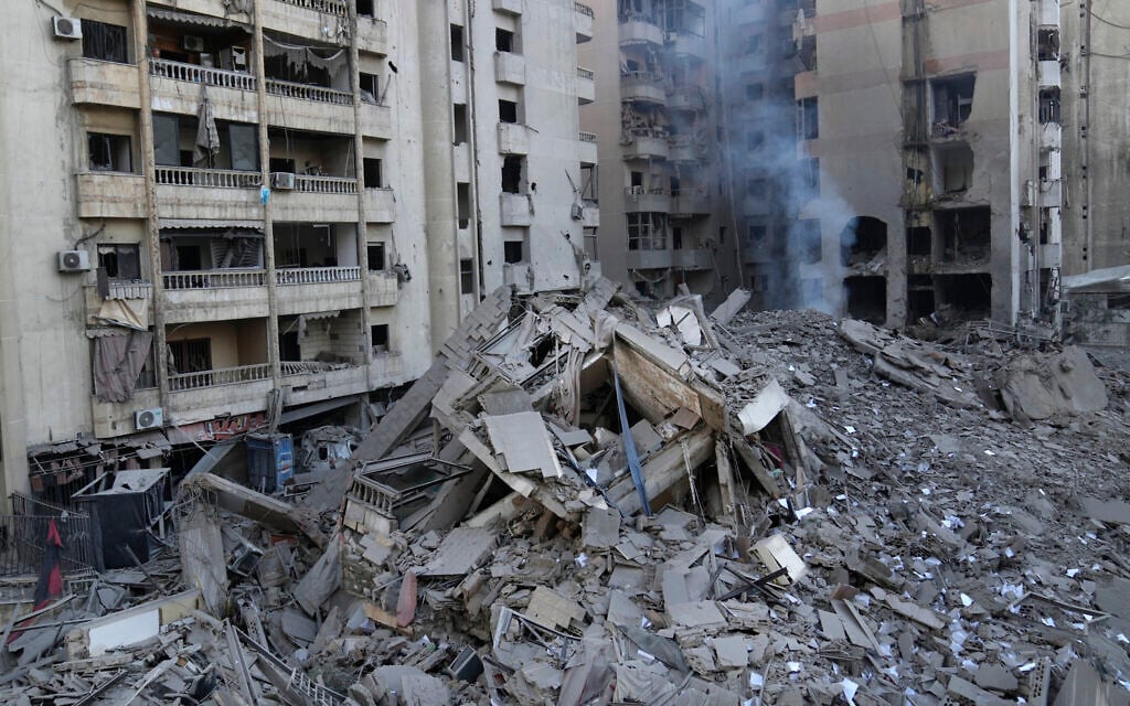 Smoke rises from a destroyed building that was hit by an Israeli airstrike on Dahiyeh, in the southern suburb of Beirut, Lebanon, November 1, 2024. (AP Photo/Hussein Malla)
