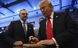 Donald Trump, right, signs autographs as Massad Boulos watches during a visit to Dearborn, Michigan on November 1, 2024. (AP/Julia Demaree Nikhinson)
