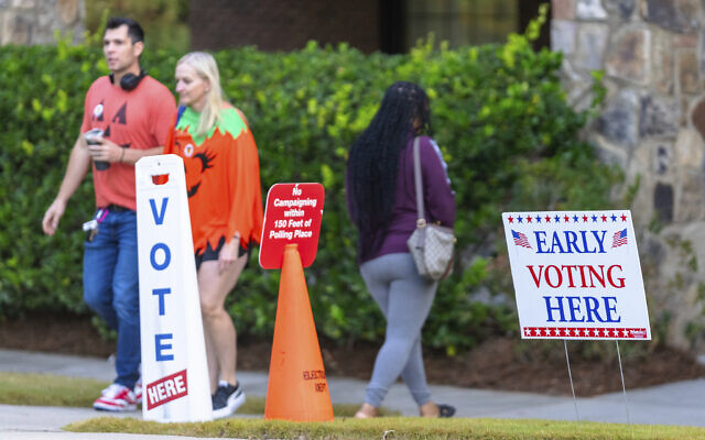 An Early Voting sign and a "No Campaigning within 150 feet of Polling Place" sign seen the polling station, October 31, 2024, in Stockbridge, Georgia. (AP Photo/Jason Allen) An Early Voting sign and a "No Campaigning within 150 feet of Polling Place" sign seen the polling station, October 31, 2024, in Stockbridge, Georgia. (AP Photo/Jason Allen)