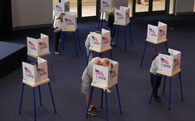 US voters work on their ballots at a polling place at the Ronald Reagan Presidential Library, in Simi Valley, California, on Election Day, November 5, 2024. (AP/Chris Pizzello)