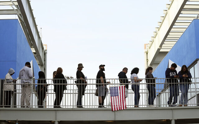 Voters wait in a long line at a polling place at the Michelle and Barack Obama Sports Complex on Election Day, Tuesday, Nov. 5, 2024, in Los Angeles. (AP/Chris Pizzello)