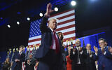 Victorious Republican presidential nominee former President Donald Trump waves as he walks with former first lady Melania Trump at an election night watch party at the Palm Beach Convention Center, November 6, 2024, in West Palm Beach, Florida (AP Photo/Evan Vucci)