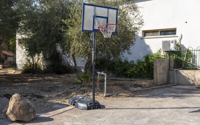 A basketball court stands empty in 'Trump Heights' in the Golan Heights, November 7, 2024. (AP Photo/Ariel Schalit)