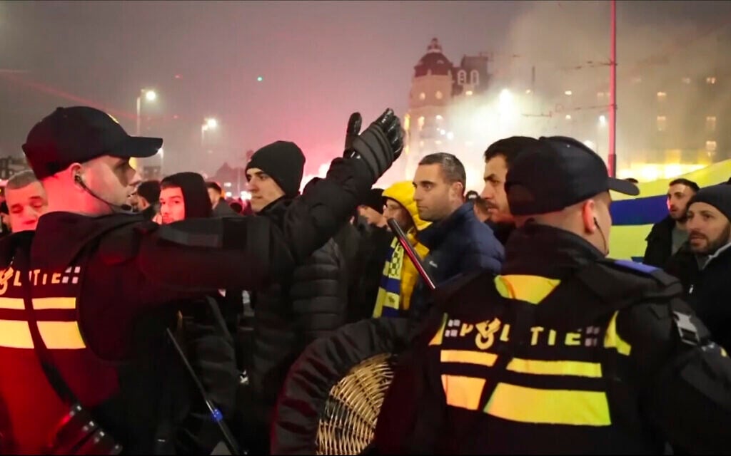 In this image taken from video, police escort Maccabi Tel Aviv supporters to the metro station leading them to the Ajax stadium, after anti-Israel protesters marched near the stadium, in Amsterdam, the Netherlands, November 7, 2024. (AP Photo InterVision) In this image taken from video, police escort Maccabi Tel Aviv supporters to the metro station leading them to the Ajax stadium, after anti-Israel protesters marched near the stadium, in Amsterdam, the Netherlands, November 7, 2024. (AP Photo InterVision)