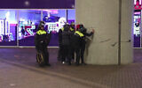 In this image taken from video, police frisk anti-Israel protesters near the Ajax stadium in Amsterdam, the Netherlands, Thursday, November 7, 2024. (AP Photo InterVision)
