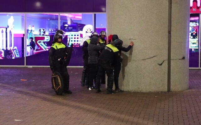 In this image taken from video, police frisk anti-Israel protesters near the Ajax stadium in Amsterdam, the Netherlands, Thursday, November 7, 2024. (AP Photo InterVision) In this image taken from video, police frisk anti-Israel protesters near the Ajax stadium in Amsterdam, the Netherlands, Thursday, November 7, 2024. (AP Photo InterVision)