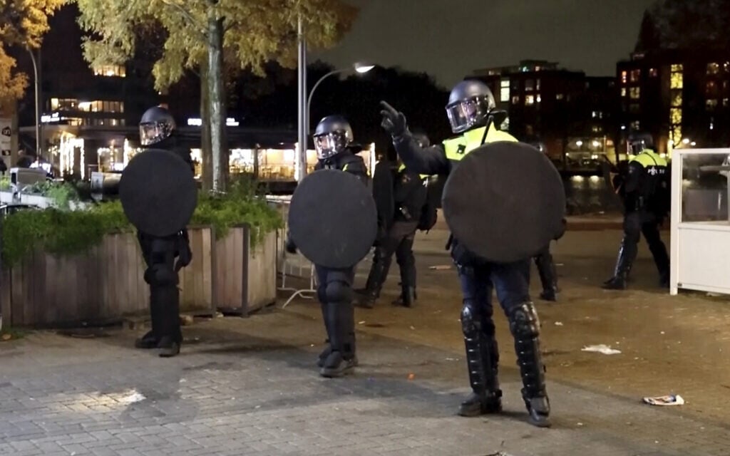 In this image taken from video, police officers patrol in riot gear on the streets of Amsterdam, Monday Nov. 11, 2024, as the city is facing tensions following violence last week. (AP Photo In this image taken from video, police officers patrol in riot gear on the streets of Amsterdam, Monday Nov. 11, 2024, as the city is facing tensions following violence last week. (AP Photo
