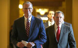 Newly-elected Senate Majority Leader Sen. John Thune, left, and newly elected Senate Majority whip, Sen. John Barrasso, right, arrive for a news conference on Capitol Hill, Wednesday, Nov. 13, 2024, in Washington. (AP/Mark Schiefelbein)
