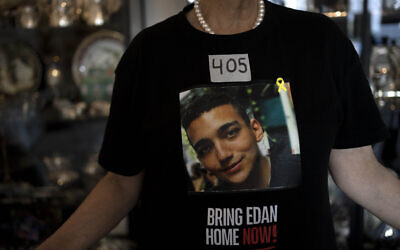 Varda Ben Baruch, whose grandson Edan Alexander is held hostage in the Gaza Strip by Hamas terrorists, wears tape marking the days since his capture, at her home in Tel Aviv, November 14, 2024. (AP Photo/Maya Alleruzzo)